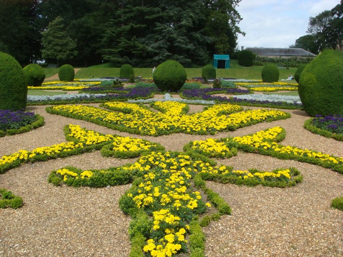 Parterre garden  infilled with flowers, with box balls