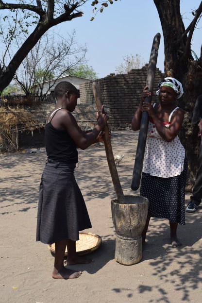 Grinding corn in Chipoka village