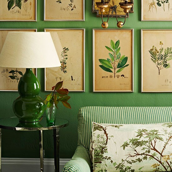 green-living-room-with-framed-prints